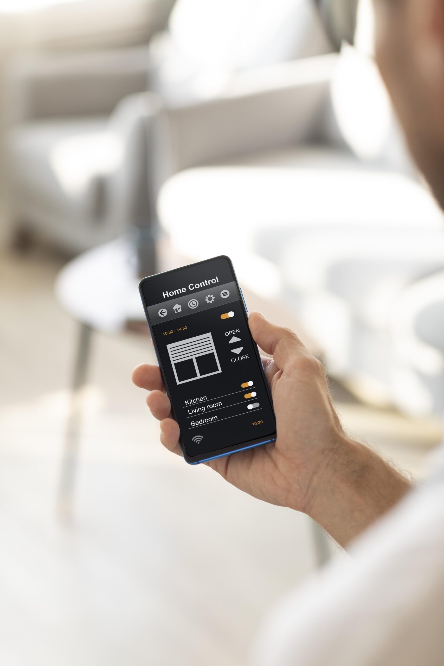 man-holding-smartphone-with-home-automation-app